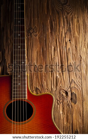 country and western guitar on wooden background