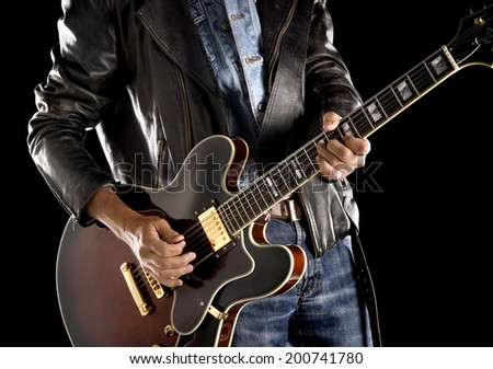 rock guitarist playing electric guitar