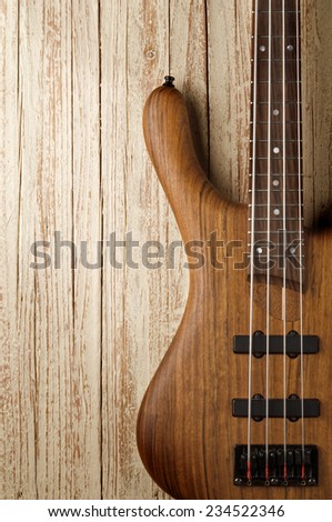 bass guitar on aged wood background