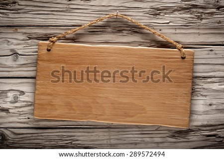 light wood rustic signboard on aged wooden wall, vintage image