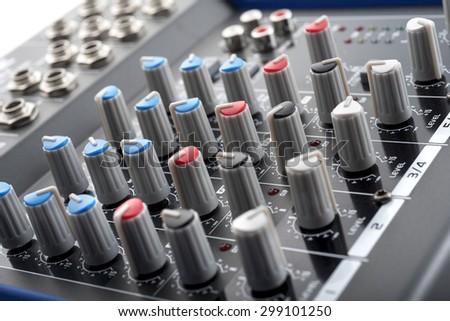 knobs board of an analog home studio mixing console