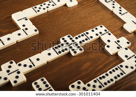 domino game tiles on wooden table