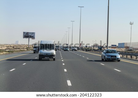 DUBAI, UAE - DECEMBER 24 2013 View of transport on Empty road, Dubai, United Arab Emirates on December 24, 2013.
