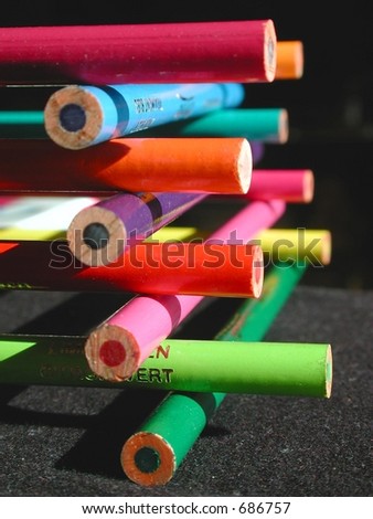 stack of colorful pencil crayons