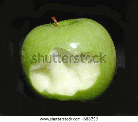 granny smith apple with black background