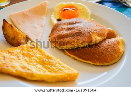 American breakfast : Ham , potato,pancake fried toast and fried-egg