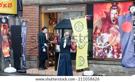 OTARU ,HOKKAIDO, JAPAN -26 JULY 2014 :Two unidentified cosplayer (wear the custume imitate cartoon character) as ancient Japanese warrior  in Otaru town , Hokkaido, Japan