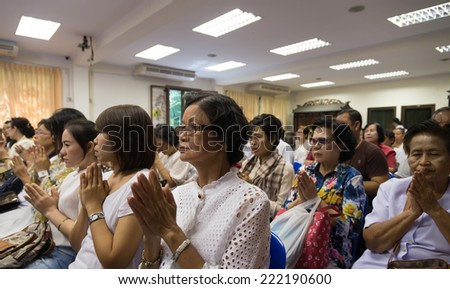 Bangkok , Thailand - September 21, 2014:  Unidentified Thai Buddhist people sit around indoor  for listen to Dhamma of Buddhism from monks at Wat Rajadhivas Temple in Dusit Area ,  Bangkok Thailand