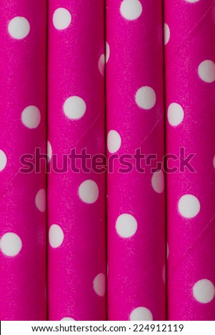 Colorful Pink white dot paper straw background in vertical