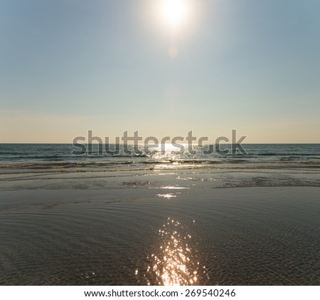 The beach with clear sea water in the afternoon with  golden sun light vintage