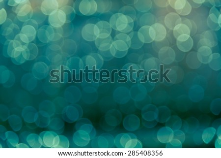 Defocused blur bokeh of green decoration light  at night in celebration festival  abstract background