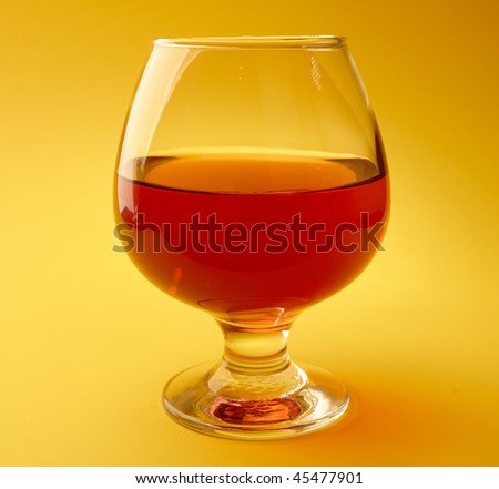 Wine glass isolated on yellow background