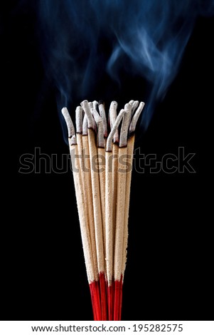 incense stick on black background
