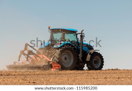 Agricultural activities, modern farm equipment in field