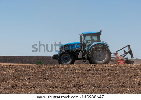Agricultural activities, modern farm equipment in field