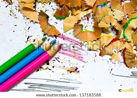 Pencil sharpener waste on a painted background