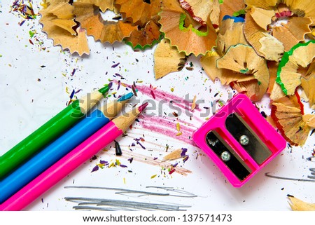 Pencil sharpener waste on a painted background