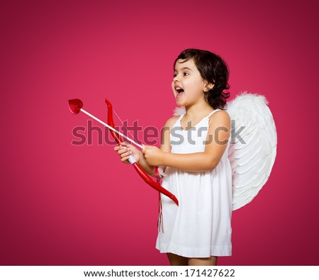 cupid little girl with a bow, arrow and wings