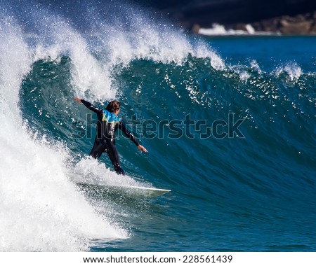 Man surfing a wave in the sea