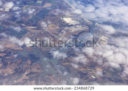 California aerial view of an inlet from the ocean through the clouds