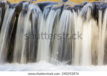 Soft waterfall with golden glow