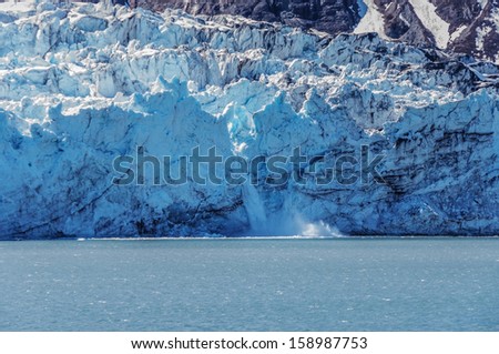 Face of Margerie glacier, during spring melt,Glacier Bay National Park, Alaska,USA.  Melting ice creating ,waterfall