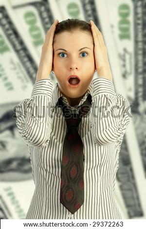 Shocked young business woman over a hundred-dollar notes background.
