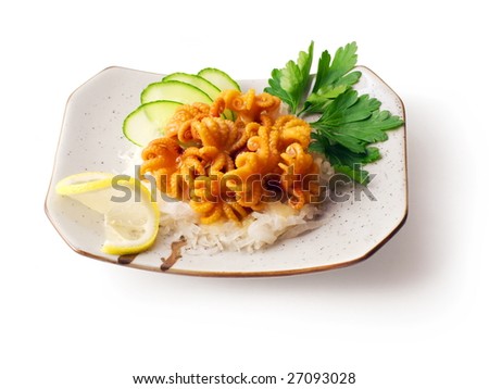 Mix from octopus, onion, cucumber with parsley and lemon on the squared plate over white background