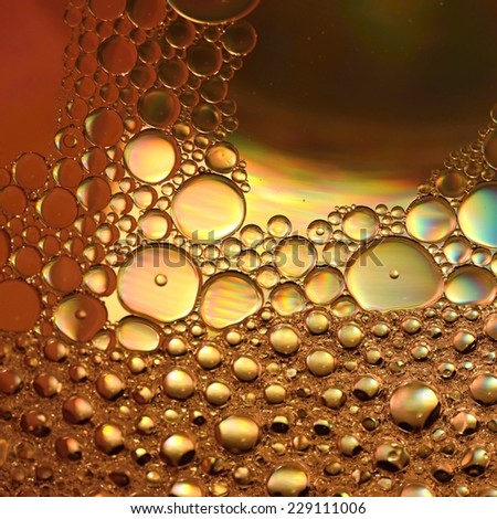 Abstraction, oil colorful bubbles in water.