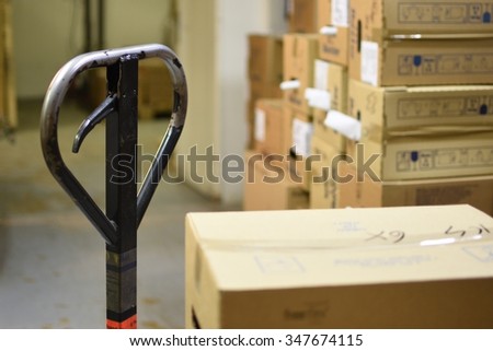 Blurred background warehouse. Abstract blurry warehouse storing. Pallet truck.