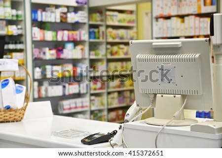 Checkout the pharmacy. Interior pharmacies and blurred background. Drugs and vitamins in pharmacies Boxes of medicines on the shelves.