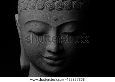 Black and white picture of Buddha statue. Buddha\'s face