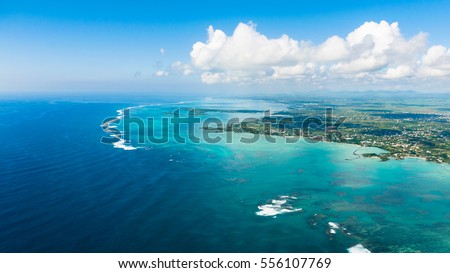 Aerial picture of the east coast of Mauritius Island. Beautiful lagoon of Mauritius Island shot from above.