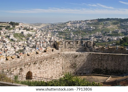 Walls of the old city in Jerusalem with the new walls of the West Bank in the background