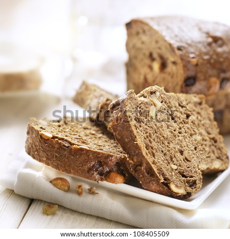 Sliced bread with nuts on a plate