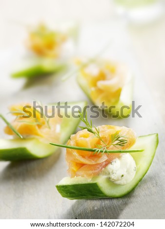 cucumber filled with cheese and smoked salmon with a little garnish