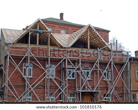 Old red brick house under repairing, change roof