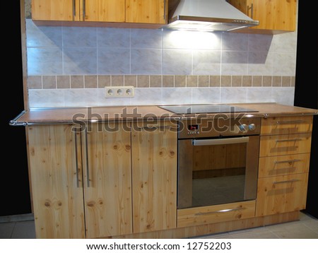 Wooden kitchen furniture with electric range and oven