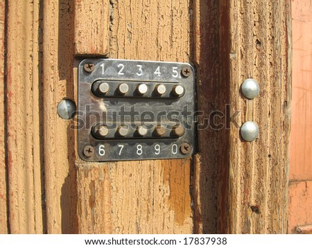 Old wooden doors with the electronic code lock