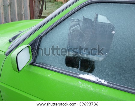 Cleaning frozen car window from the ice