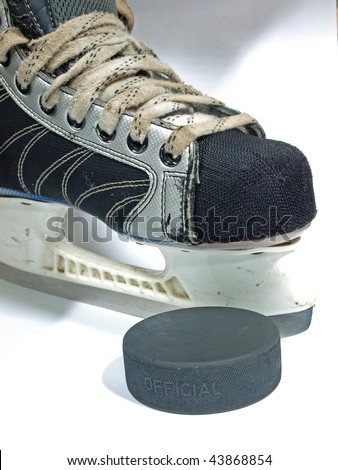Simple amateur hockey skates and the puck