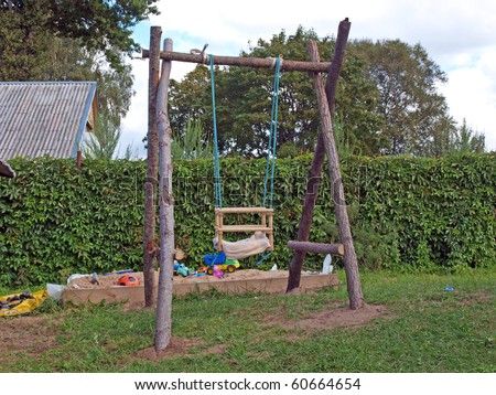 Baby playground with homemade swings and sand box