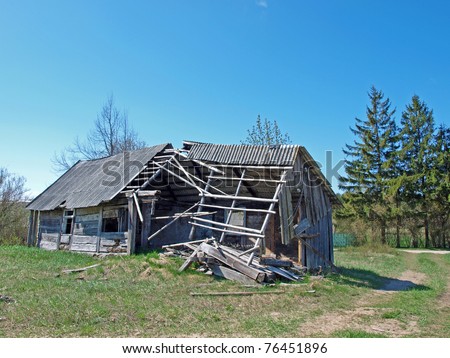 Old small abandoned and ruinous country house