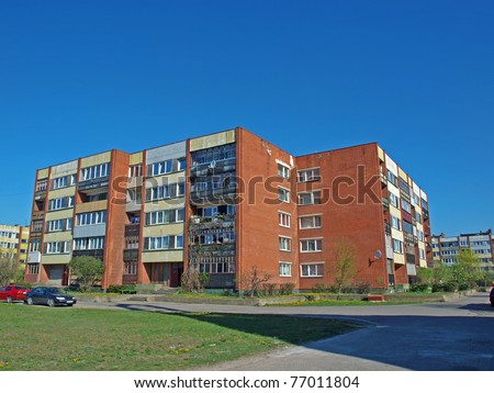 Russian red brick apartment house, sunny day
