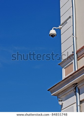 Rotating security camera looking as street lantern