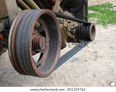 Grass mower transmission from wedge belts and pulleys