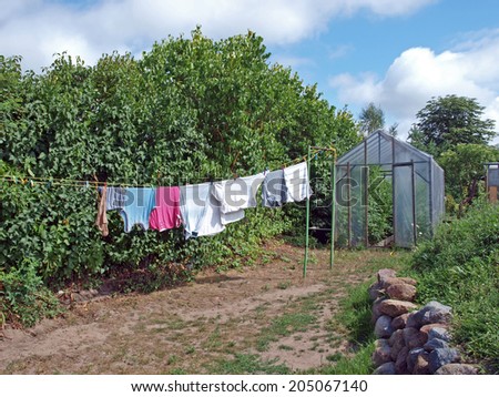 Drying clothes on the rope in country yard