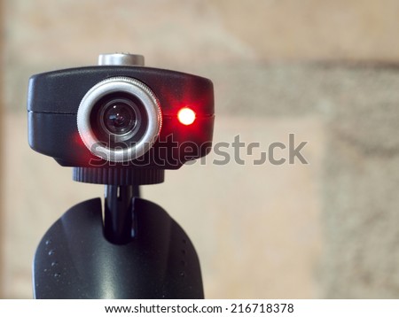 Web camera close up with red light and lens flare