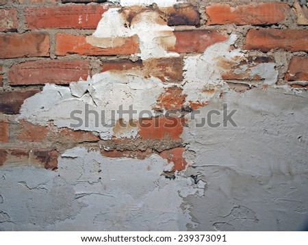Repairing old brick wall with grout close up