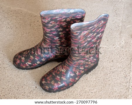 Waterproof rubber or plastic boots on concrete floor